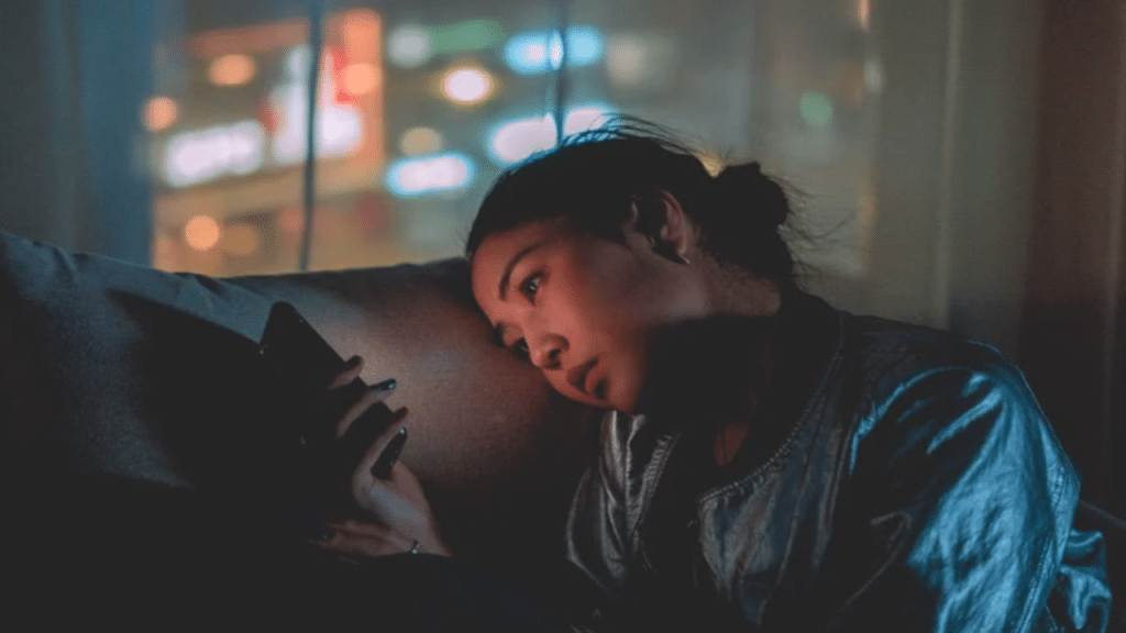 A woman waiting for a text