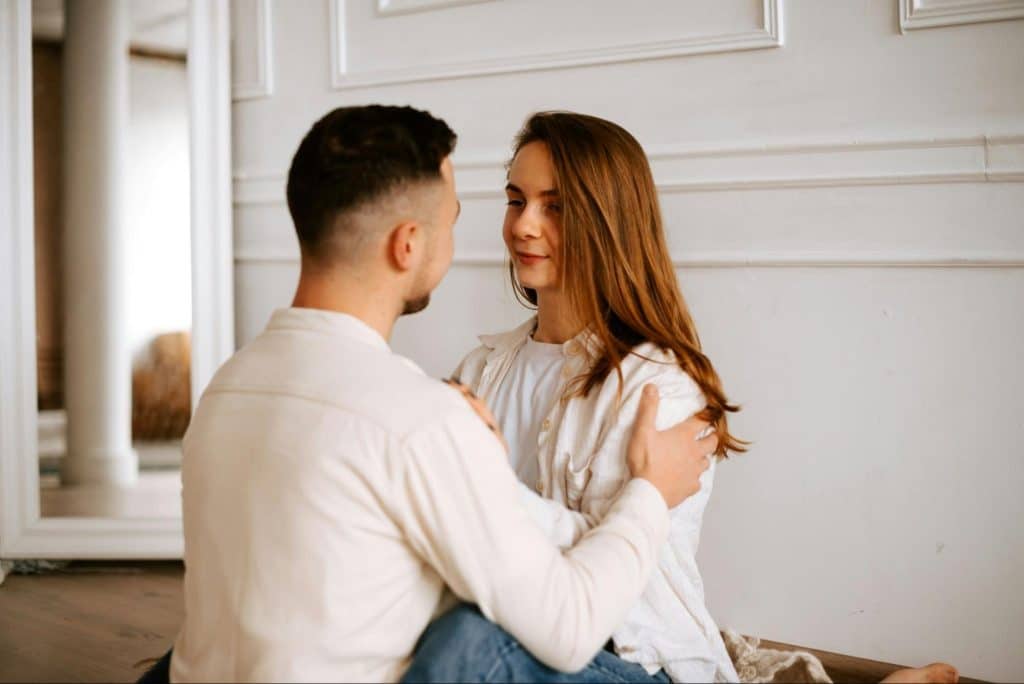 A man and woman facing each other