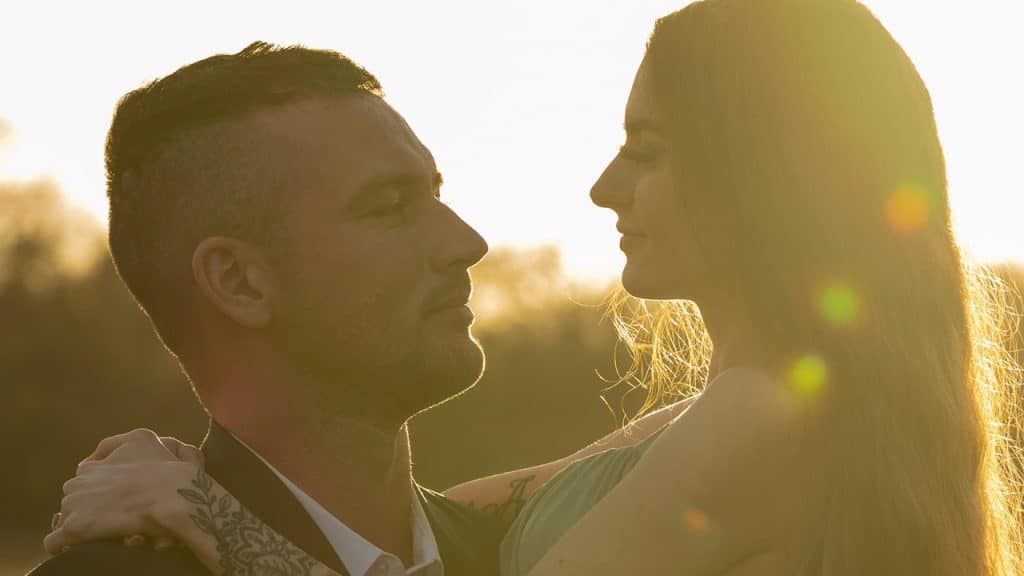 A man looking at a woman intently.