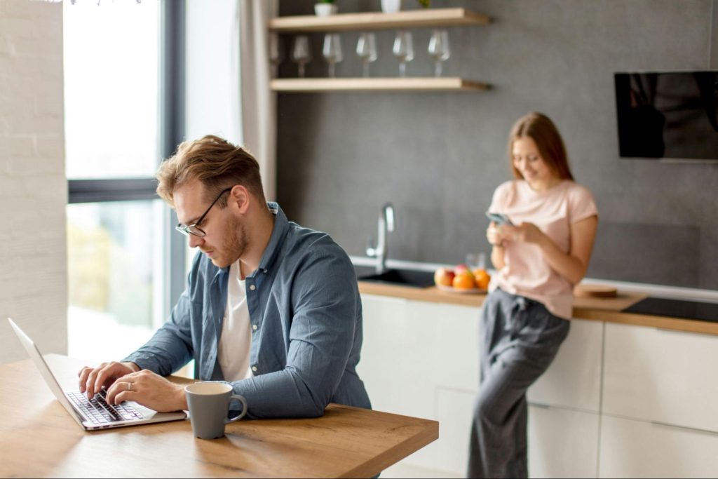 A man and woman at the kitchen