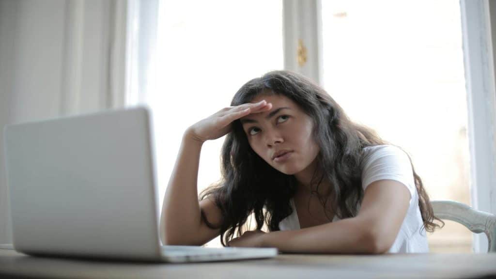 A woman looking annoyed at home