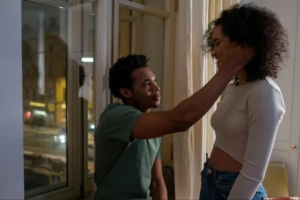 A man holding a woman’s face