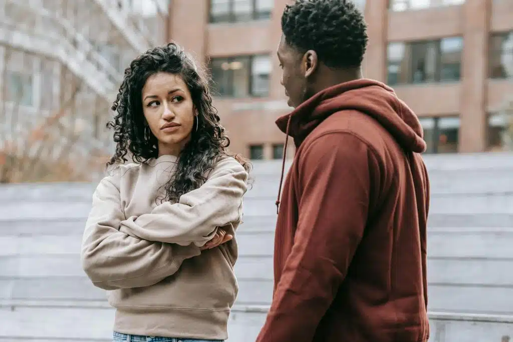 A couple arguing on the street.