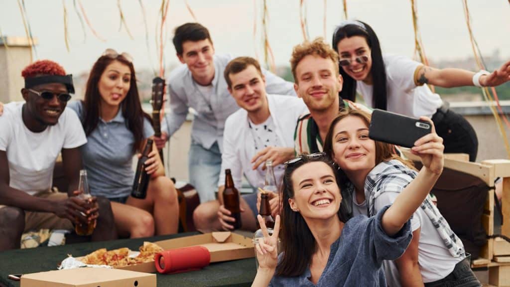 A group of friends having fun and taking a selfie. 