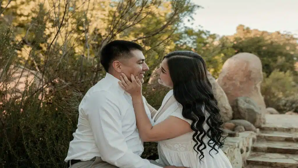 A couple about to kiss outdoors