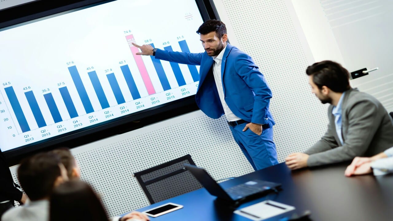 A man presenting at a business meeting 