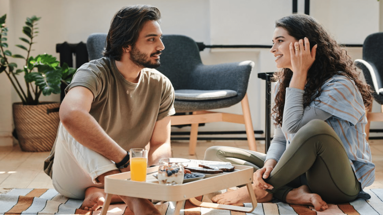A couple talking during breakfast