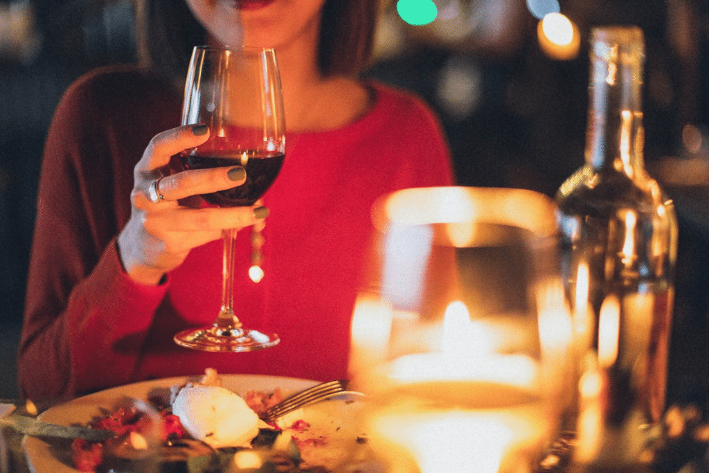 A woman holding wine glass