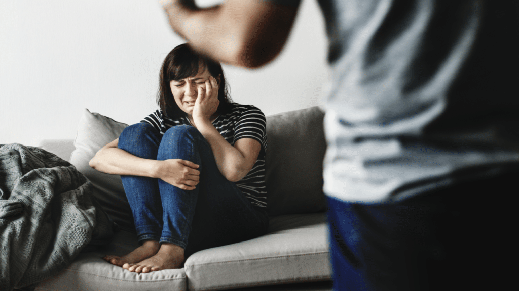 A woman crying while her husband yells