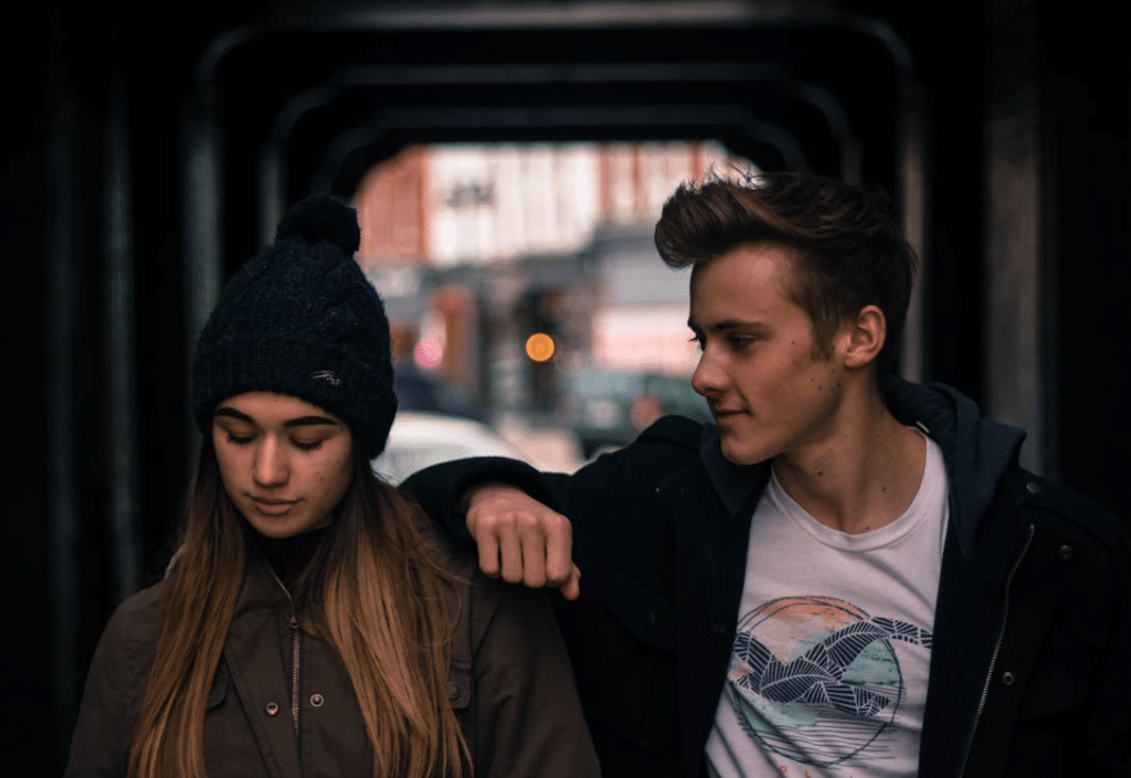 Young couple in city at night
