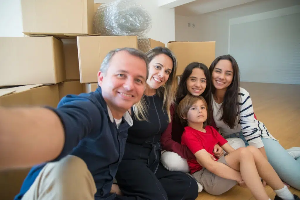 A family sitting on the floor