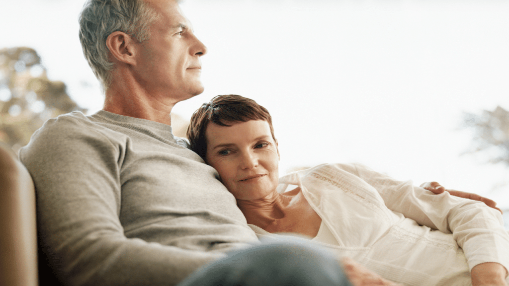 A couple sitting on a couch