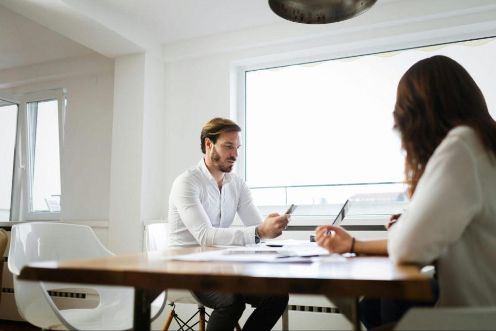 A man and woman busy with their work