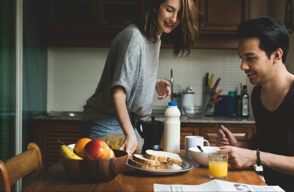 A man and woman at the kitchen