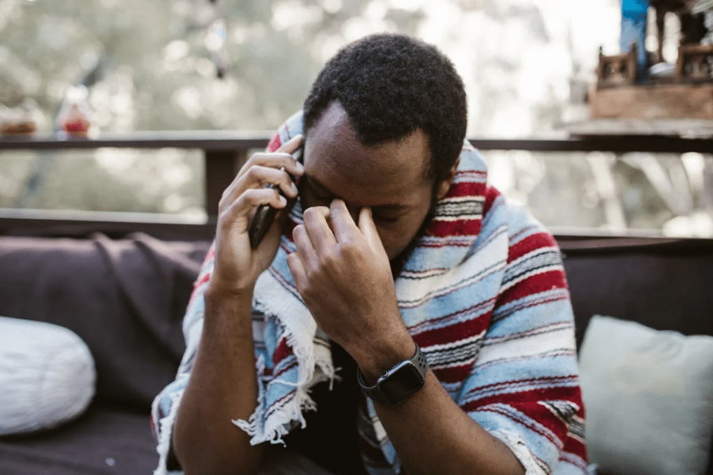 A Sad Man talking on the Phone