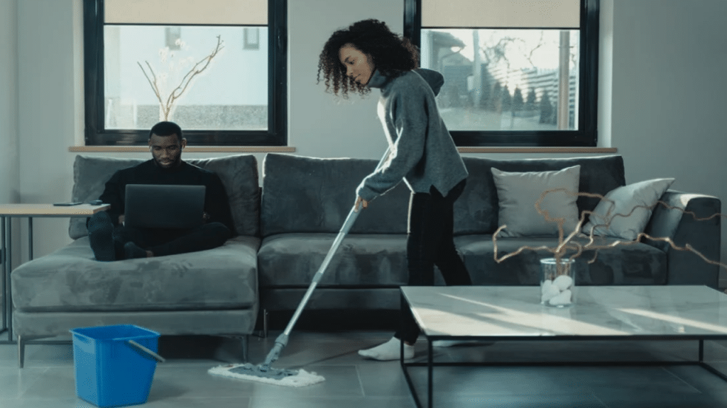 A couple doing their own thing in the living room