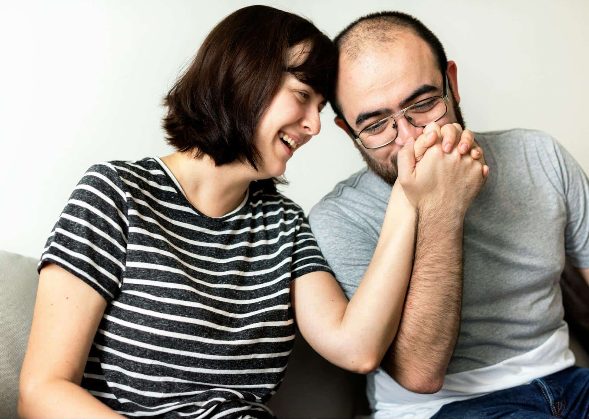 A man kissing a woman’s hand 