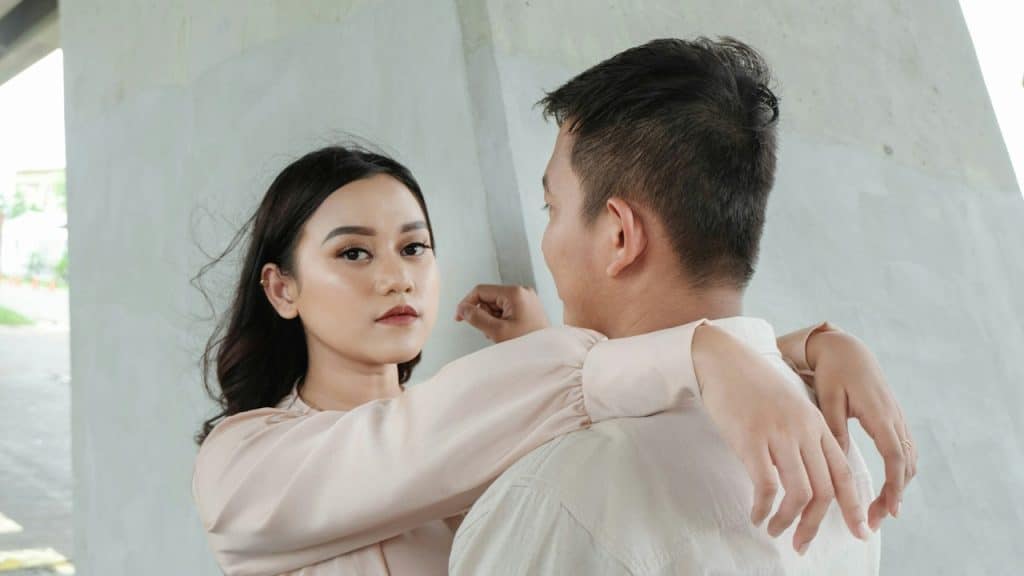 A man and a woman standing next to each other.