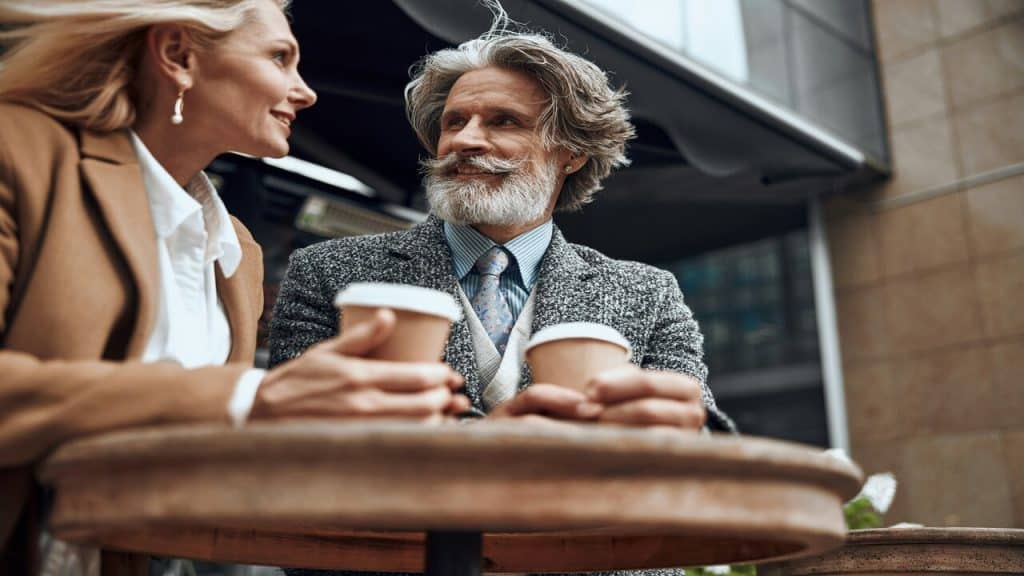 A couple having coffee outdoors