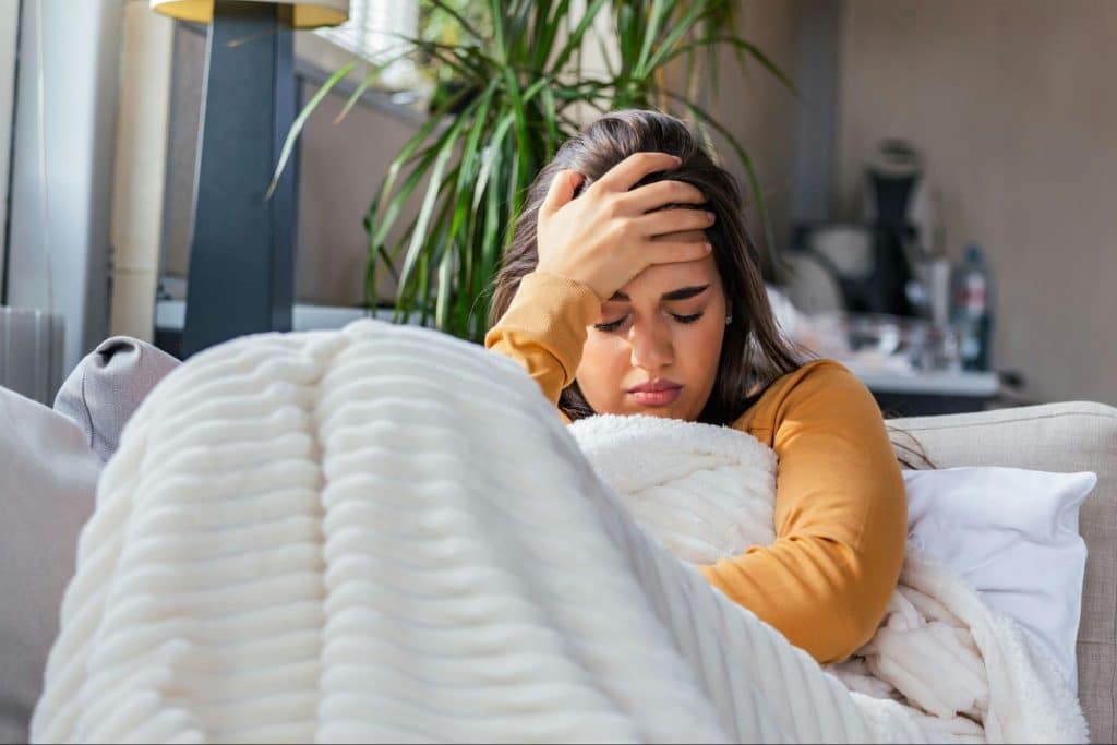 A woman sitting at the sofa alone