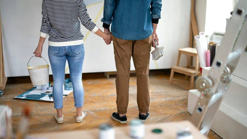 A couple getting ready to paint their wall