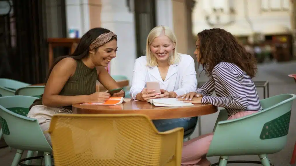 Female friends having coffee together