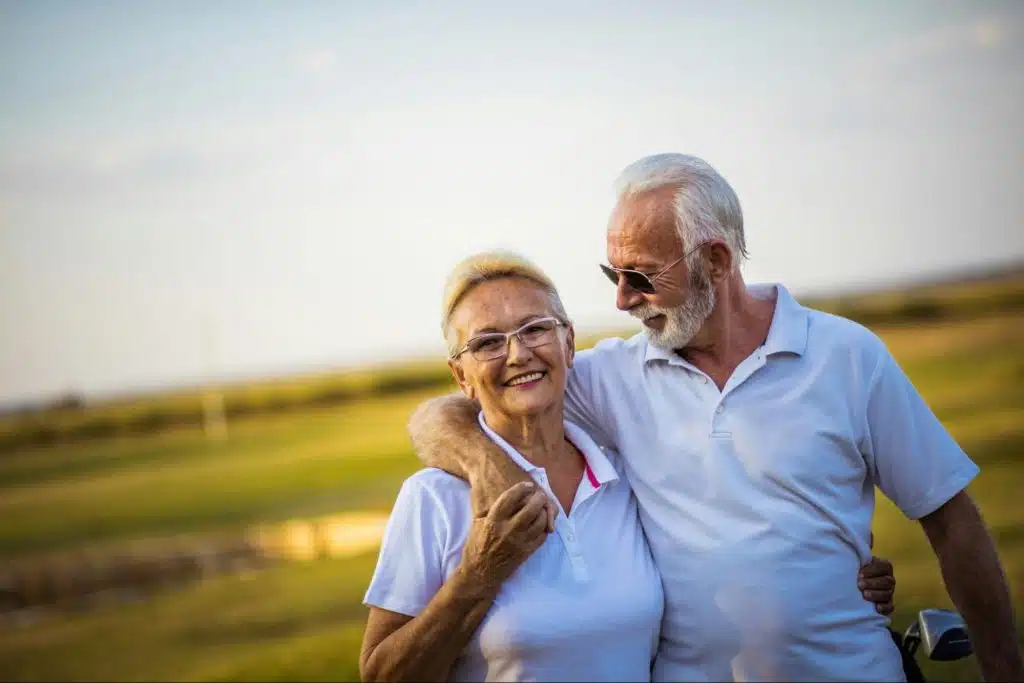 A man and woman at the grass field