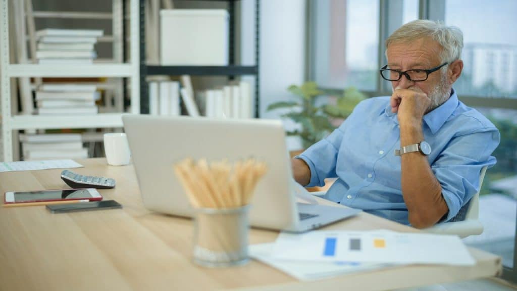 An older businessman hard at work