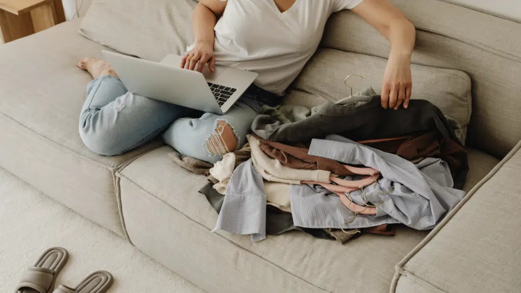 A woman working while folding laundry