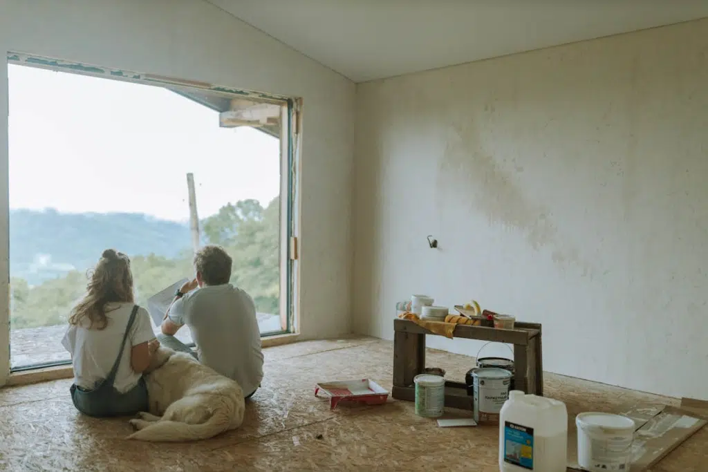 Couple sitting on the floor with a dog
