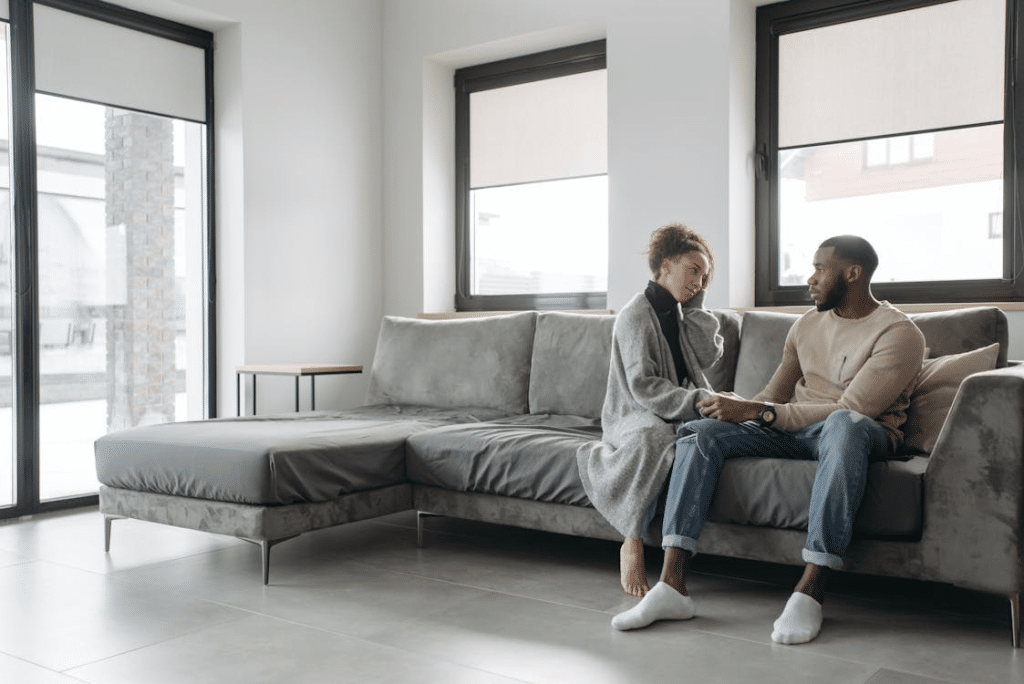 A couple sitting on a sofa
