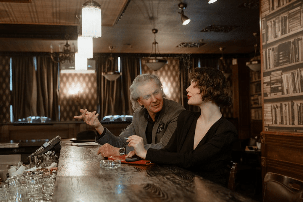 A man and a woman at a bar