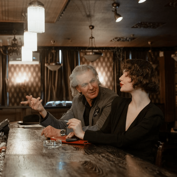 A man and a woman at a bar