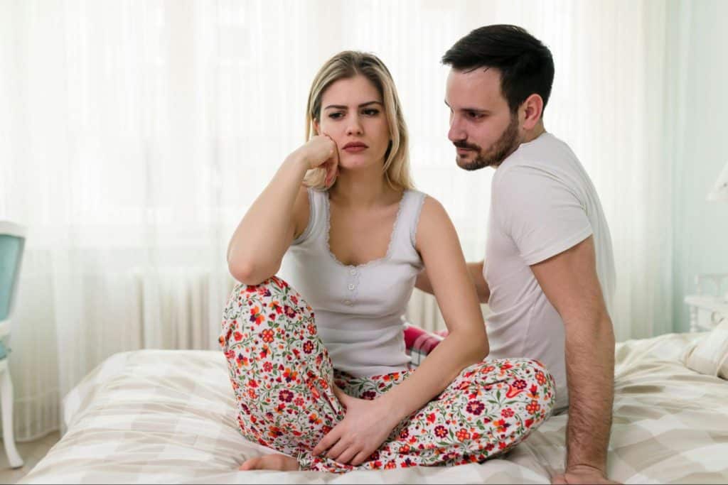 A man talking to a woman