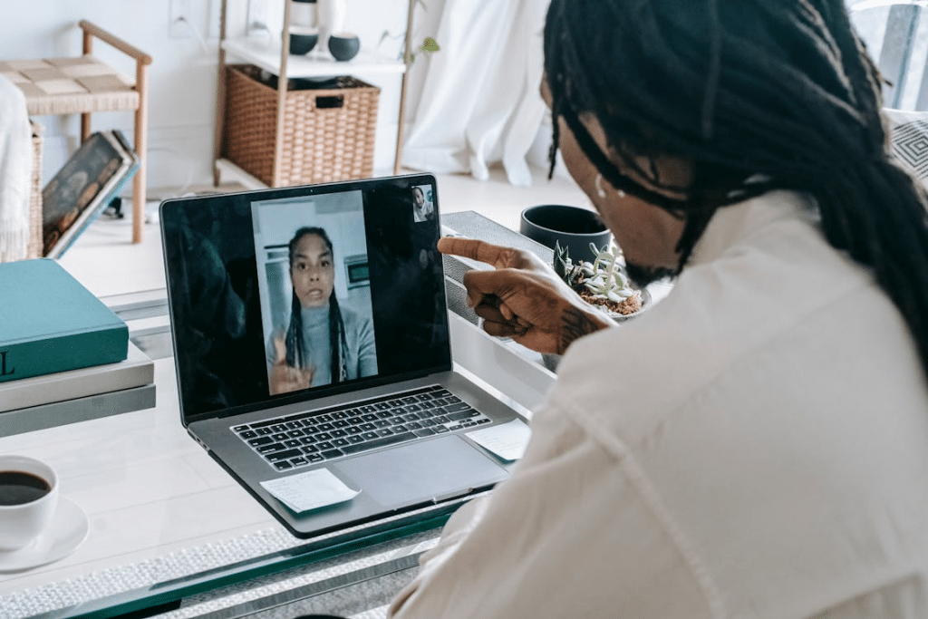 Stressed black couple having video call via laptop