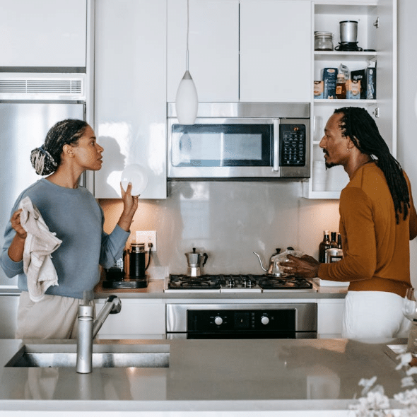 A couple arguing in the kitchen