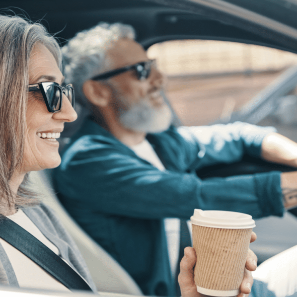 A couple driving to work together
