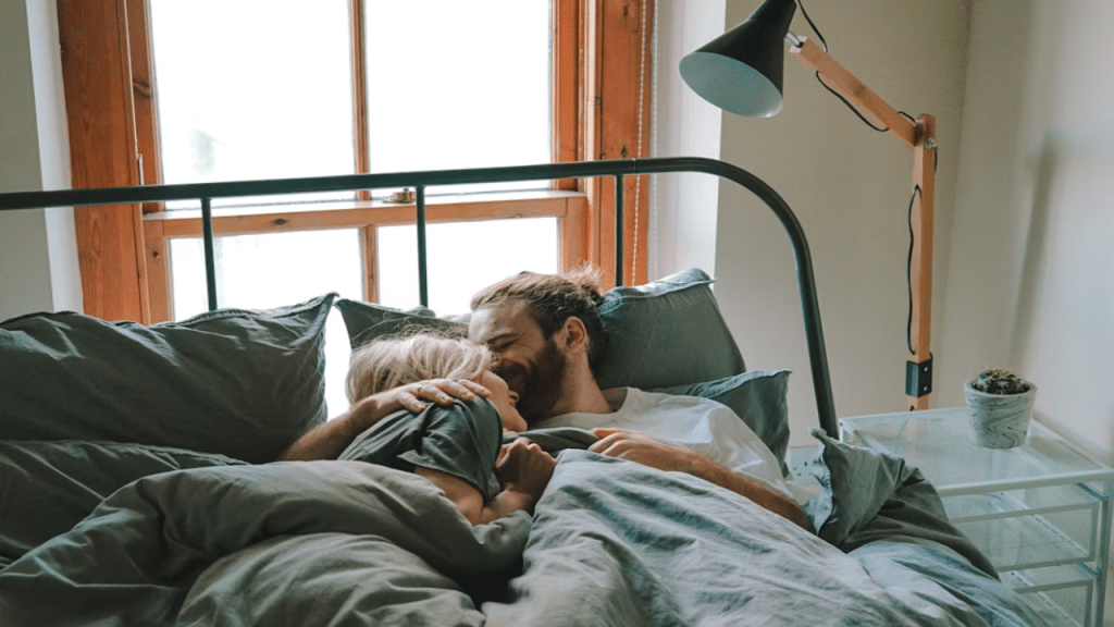 A couple talking in bed