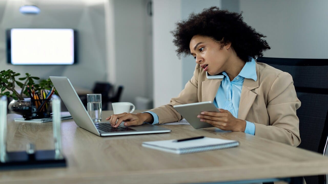 A woman multitasking at work