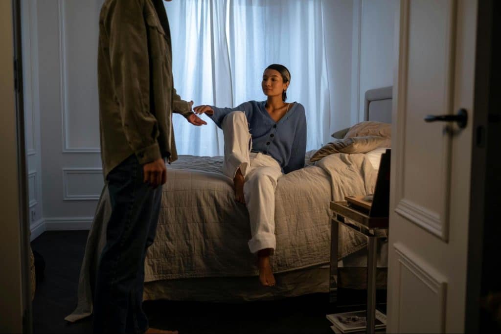 A man approaching a woman