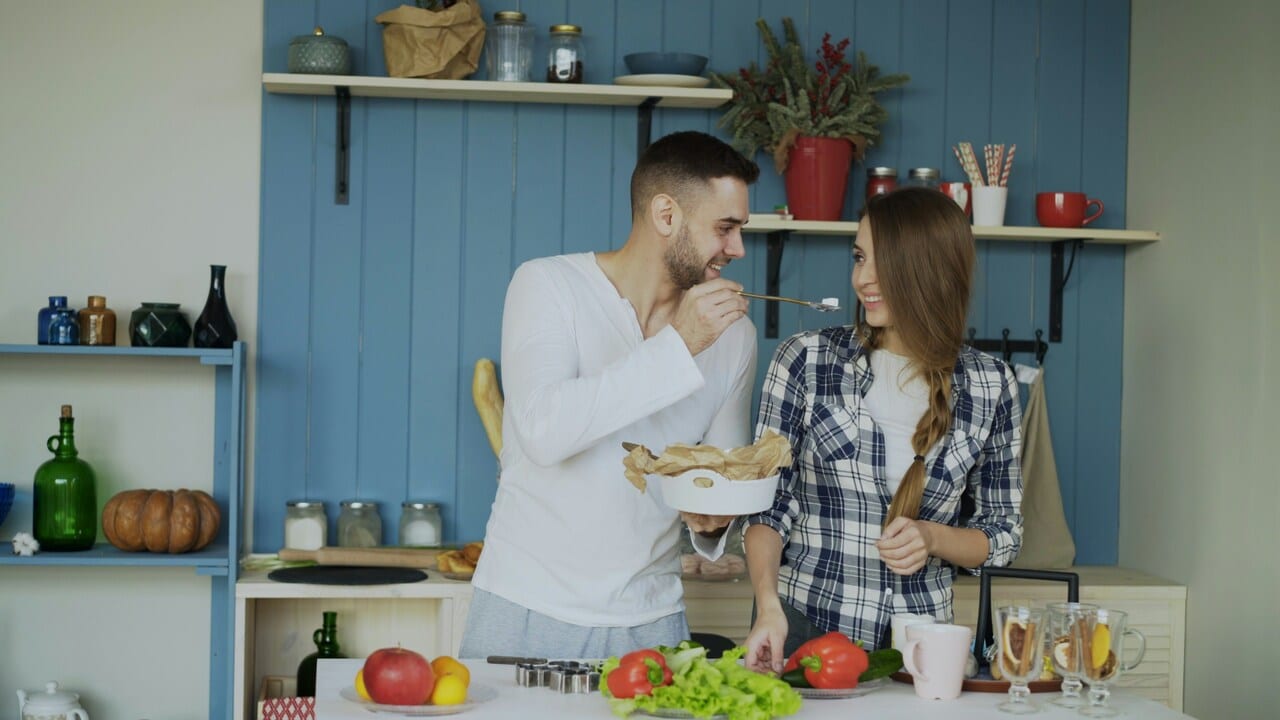 A couple having a meal at home 