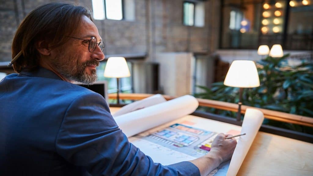 A man smiling while working