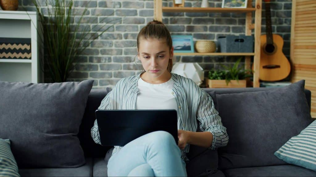 A woman alone and using laptop