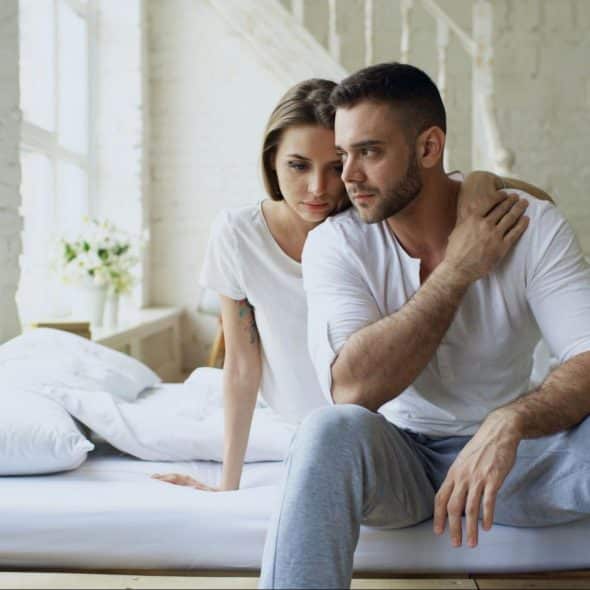 A woman hugging a man