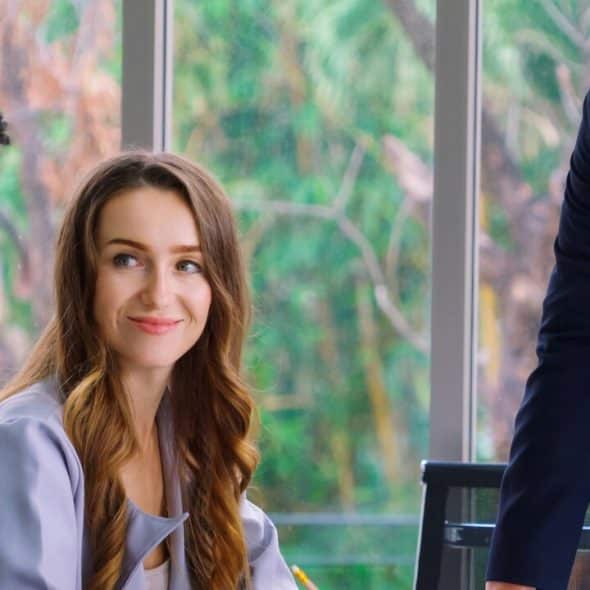 A woman looking at her colleague and smiling