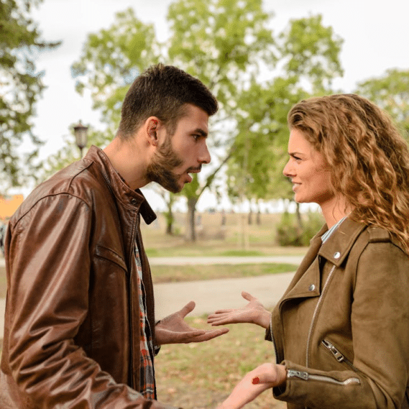 Man and woman wearing brown leather jackets