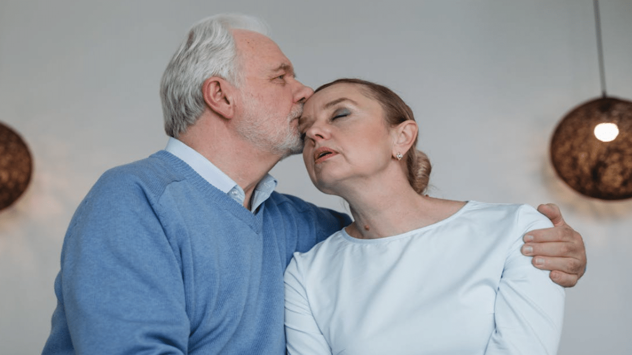 A man kissing his upset wife