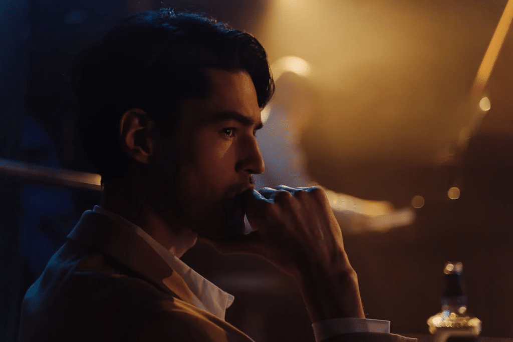 Side View of Man With His Hand on His Mouth