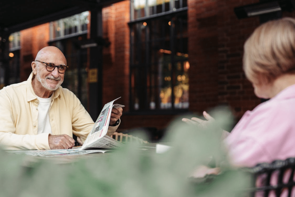 A Elderly Couple Sitting in an Outdoor Setting