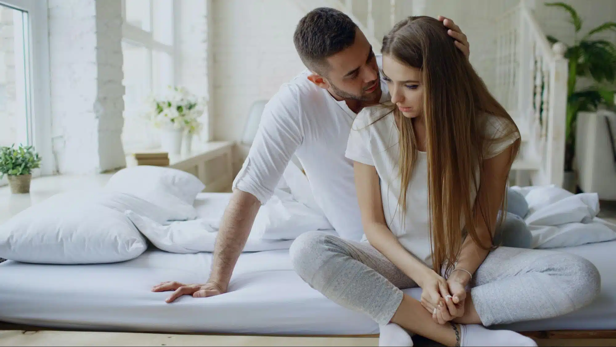 A man assuring a woman 